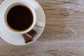 Top above overhead close up view photo of tasty morning fresh dark coffee espresso with foam and two sugary tasty sweet yummy peac