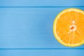 Top above overhead view close-up photo of orange slice isolated on blue wooden background with copyspace Royalty Free Stock Photo