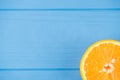 Top above overhead view close-up photo of orange slice isolated on blue wooden background with copyspace Royalty Free Stock Photo