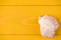 Top above overhead view close-up photo of seashell isolated on yellow wooden background with copyspace Royalty Free Stock Photo