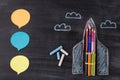 Top above overhead view photo of drawn spaceship chalk notes and clouds isolated on blackboard background with copyspace Royalty Free Stock Photo