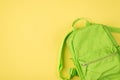 Top above overhead view photo of green backpack isolated on yellow background with copyspace blank empty space Royalty Free Stock Photo