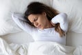 Stressed young mixed race woman feeling neck ache after sleep. Royalty Free Stock Photo