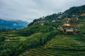 Aerial view of rice terraces and small shacks in Sapa Vietnam - October 2019