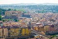 Top aerial panoramic view of Florence city, Ponte Vecchio bridge over Arno river, Palazzo Pitti palace Royalty Free Stock Photo