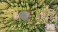 Top aerial view of abandoned water reservoir,tank, and buildings of old tin mine in Rolava,Ore mountains,Czech Republic. Beautiful Royalty Free Stock Photo