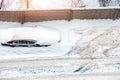 Top aerial view of apartment office building parking lot with many cars covered by snow stucked after heavy blizzard Royalty Free Stock Photo