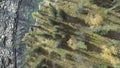 Top aerial view of a blue clear river flowing in the coniferous summer forest. Clip. Pure mountain water in the natural Royalty Free Stock Photo