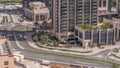 Top aerial view of busy road intersection and traffic junctions in Dubai city timelapse.