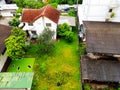 Top or aerial view of many home. house or village, roof with tree and grass field among in the city. Royalty Free Stock Photo