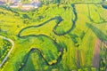 Top aerial view of the natural rural landscape valley of a meandering river among green fields and forests Royalty Free Stock Photo