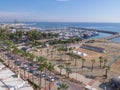 Balcony view over the Palm trees promenade and port with many boats in Larnaca town Royalty Free Stock Photo
