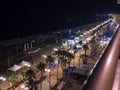 Top view over nightlit Finnikoudes promenade with palms and port in Larnaca, Cyprus Royalty Free Stock Photo