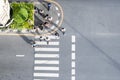 Top aerial view people walk on across pedestrian at the outdoor pedestrian concrete ground