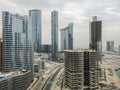 Top aerial view shot of Al Reem island Sun and Sky towers and landmarks in Abu Dhabi city, UAE