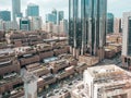 Top aerial view shot of skyscrapers in a modern city with fog clouds passing by - Downtown Abu Dhabi landmarks and World Trade Cen