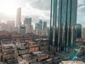 Top aerial view shot of skyscrapers in a modern city with fog clouds passing by - Downtown Abu Dhabi landmarks and World Trade Cen