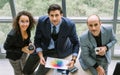 Top, aerial view three female and male Caucasian businesspeople wearing formal suit, meeting strategy plan, working together with Royalty Free Stock Photo