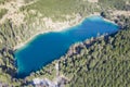 Top aerial view to fresh blue lake urisee in green austrian alps forest Royalty Free Stock Photo