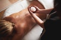 Top angle of massage therapist with bowl of salt Royalty Free Stock Photo