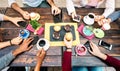 Top angle view of hands with phones at coffee shop restaurant - People having breakfast together with mobile smartphones