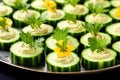 top an arrangement of cucumber slices with hummus using spoon Royalty Free Stock Photo