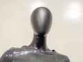 Top of a black abstract mannequin in black sequin clothing