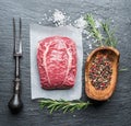 The top blade steak or beef steak on the graphite board with herbs and spices Royalty Free Stock Photo