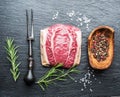 The top blade steak or beef steak on the graphite board with herbs and spices Royalty Free Stock Photo