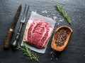 The top blade steak or beef steak on the graphite board with herbs and spices Royalty Free Stock Photo