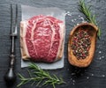 The top blade steak or beef steak on the graphite board with herbs and spices Royalty Free Stock Photo