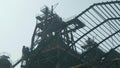 Top of blast furnace of abandoned metallurgic plant. Rusted metal constructions. Counter light.