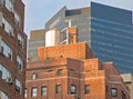 Top of a brick apartment building with typical water tower, New York