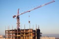 Top of a building under construction with a crane Royalty Free Stock Photo