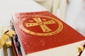 Top of a Catholic bible isolated on a fuzzy white background