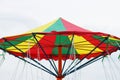 The top of a child`s portable carousel against the background of a light sky. Royalty Free Stock Photo