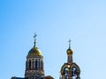 Top of the Christian Orthodox Church with golden domes and crosses against the blue sky Royalty Free Stock Photo