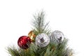 Top of Christmas tree. Green pine branches decorated with golden, silver, and red balls. Silver, golden, red balls are out of Royalty Free Stock Photo