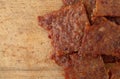 Pork jerky on a wood cutting board