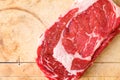 Top close view of a ribeye steak on an old wood cutting board Royalty Free Stock Photo