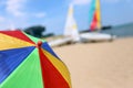 Top of a Colorful Beach Umbrella against the Sky and boat and sea Royalty Free Stock Photo