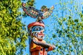 The top of the colorful `Ga`akstalas Totem Pole` depicting a Quolous, a legendary bird.