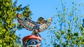 The top of the colorful `Ga`akstalas Totem Pole` depicting a Quolous, a legendary bird.