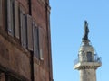 Top of a column with the statue of Imperor Trajan to Rome in Italy.