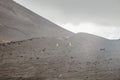 Top of crater Mount Etna volcano, frozen cold lava smokes, thick clouds Royalty Free Stock Photo