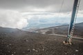 Top of crater Mount Etna volcano, frozen cold lava smokes, thick clouds Royalty Free Stock Photo