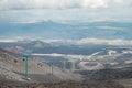 Top of crater Mount Etna volcano, frozen cold lava smokes, thick clouds Royalty Free Stock Photo