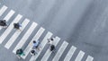 the From the top crosswise view of people walk on street pedestrian crossroad in the city street ,bird eye view.