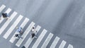 the From the top crosswise view of people walk on street pedestrian crossroad in the city street ,bird eye view.