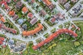 Top down aerial image of a suburb in the summer. backyards with green grass and lush trees Royalty Free Stock Photo